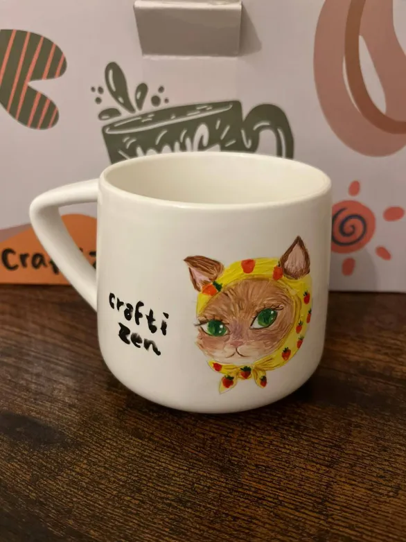 Hand-painted cat mug with Craftizen branding
